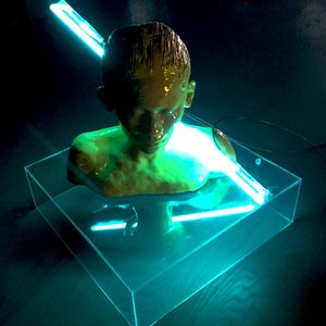 Yellow glazed ceramic bust with turquoise neon light – Inner Light
