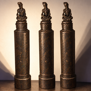 Small bronze Buddha sculpture inspired by a figure carved directly into lipstick in Japan in 1996.